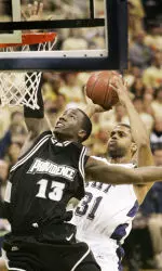 Mike Cook gets off a shot behind Providence's Weyinme Efejuku.