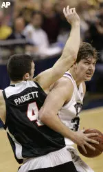 Aaron Gray tries to get around Louisville's David Padgett.. (AP Photo/Keith Srakocic)