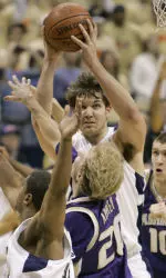 Pittsburgh's Aaron Gray, center, goes up for a shot as he is defended by Washington's Ryan Appleby (20) in the first half of the basketball game in Pittsburgh, Saturday, Feb. 17, 2007. Pittsburgh's Mike Cook is at left; Washington's Spencer Hawes is at right. (AP Photo/Keith Srakocic)