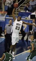 Sam Young (23) flies through the air as Wright State's Scottie Wilson (2) and DaShaun Wood, right, look on. (AP Photo)
