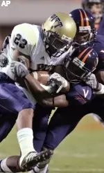Lowell Robinson (23) gets tied up by Virginia cornerback Ras-I Dowling, right front. (AP Photo)