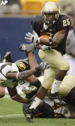 Pittsburgh running back LeSean McCoy runs through Grambling State cornerback DeMichael Dizer, left, for his thrid touchdown in the first quarter. (AP Photo/Keith Srakocic)