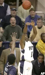 Keith Benjamin, who finished with 18 points, shoots for three over Georgetown's Roy Hibbert in the first half.