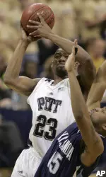 Sam Young shoots over Villanova's Reggie Redding in the first half.