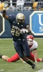 LeSean McCoy skirts the sideline after avoiding Rutgers linebacker Ryan D'Imperio in the first half.