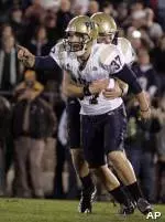 Kicker Conor Lee (37) celebrates with holder Andrew Janocko after kicking the game-winning filed goal in the 4th overtime period.