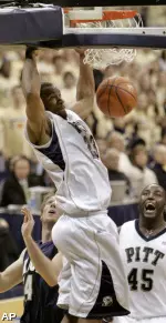 Sam Young, top, dunks behind Akron's Mike Bardo. (AP)
