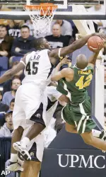 DeJuan Blair blocks a shot by Siena's Alex Franklin . (AP)