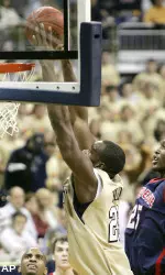 Sam Young gets by Duquesne's Damian Saunders and dunks. (AP)