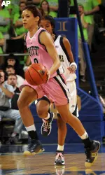 Pittsburgh guard Mallorie Winn heads up court as Notre Dame player Charel Allen trails during the first half (AP Photo)
