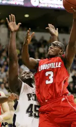 DeJuan Blair is called for a fouls as Louisville's Juan Palacios drives the lane in the second half. (AP Photo/Don Wright)