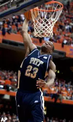 Sam Young dunks against Syracuse during the first half. (AP Photo/Kevin Rivoli)