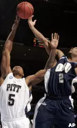 Tyrell Biggs (and Oral Roberts forward Andre Hardy go up for a rebound during the second half in Denver. (AP Photo/Jack Dempsey)