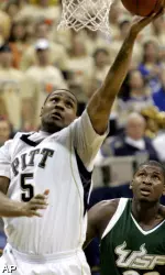 Tyrell Biggs, left, shoots in front of South Florida's Mobolaji Ajayi. (AP)