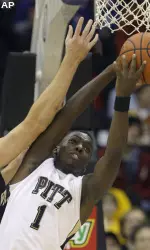 Travon Woodall fights for a rebound in the first half.