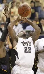 Brad Wanamker, right, is fouled by Kent State's Justin Greene as he shoots during the first half. (AP Photo/Keith Srakocic)