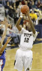 Ashton Gibbs, right, hits a three point shot over DePaul's Jimmy Drew.