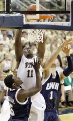 Pittsburgh's Dante Taylor (11) tries for a basket on a rebound, but misses as New Hampshire's Dane DiLiegro (1) and Russell Graham (5) defend in the first half of an NCAA college basketball game in Pittsburgh, Friday, Dec. 4, 2009. (AP Photo/Keith Srakocic)