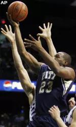 Sam Young (23) drives to the basket