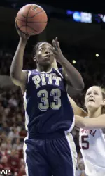 Xenia Stewart takes a shot in front of Whitney Hand in the first half.