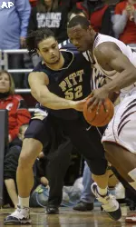 Gary McGhee (52) and Cincinnati forward Yancy Gates, right, fight for a loose ball in the first half.