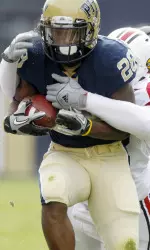 Running back Dion Lewis (28) tries to get away from Louisville defensive tackle Brandon Dunn (92) on a run in the second quarter. (AP Photo/Keith Srakocic)