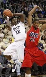 Pittsburgh's Ashton Gibbs (12) shoots over Illinois-Chicago's' Zavion Neely (23) in the first half