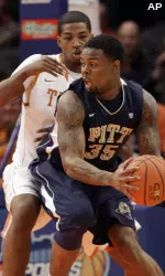 Nasir Robinson protects the ball from Texas' Tristan Thompson in the first half.