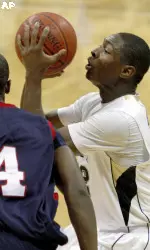 Ashton Gibb, right, shoots in front of Robert Morris' Karon Abraham in the first half.