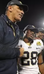 Football Coach Dave Wannstedt and RB Dion Lewis