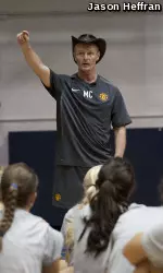 Mike Clegg speaks to the Pitt women's soccer team following a conditioning test
