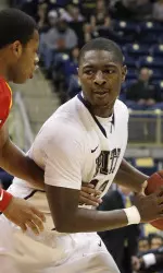 Pittsburgh's Ashton Gibbs, right, tries to get around VMI's Rodney Glasgow in the first half.