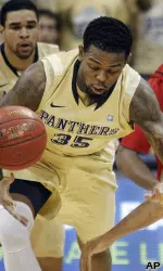 Nasir Robinson steals a ball from Louisville's Peyton Siva.