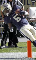 Cameron Saddler keeps his foot in bounds after making a catch for a touchdown in the first quarter.