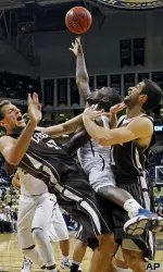 Tray Woodall shoots under pressure.