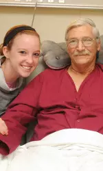 Army veteran, Edward Leudke pictured with sophomore volleyball player Cassandra Congemi and junior soccer player Danielle Benner.