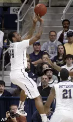 Pittsburgh's J.J. Moore hits a 3-point shot in front of South Florida's Augustus Gilchrist.