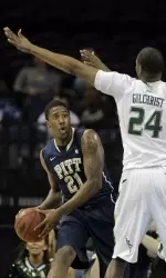 Pittsburgh guard Lamar Patterson (21) looks to pass the ball as he is double-teamed by South Florida forward Augustus Gilchrist (24) and forward Victor Rudd (2) during the first half.