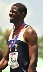 Jermaine Lowery stands with his gold medal in the 400-meter hurdles.