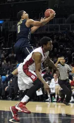 James Robinson drives to the basket against Stanford on Tuesday.