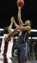 Michael Young shoots the ball against Duquesne forward Ovie Soko.