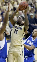 Dante Taylor shoots over Seton Hall's Kevin Johnson.