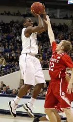 Josh Newkirk shoots over North Carolina State Wolfpack guard Tyler Lewis. (Charles LeClaire-USA TODAY Sports)