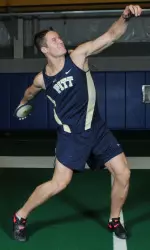 Andrew Wells breaks the school record in the discus throw.