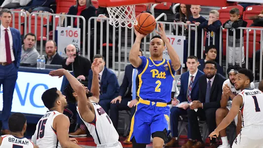 Trey McGowens attempting a shot against Robert Morris