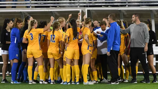 women's soccer team huddle