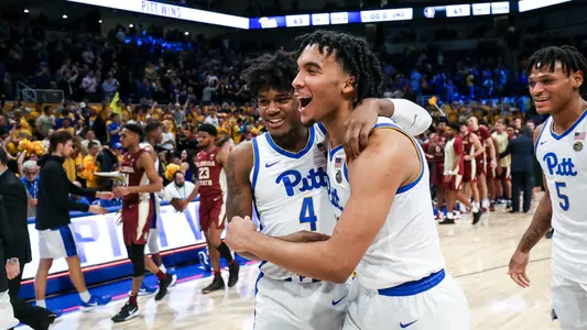 Justin Champagnie & Gerald Drumgoole, Jr. celebrating the win against Florida State.