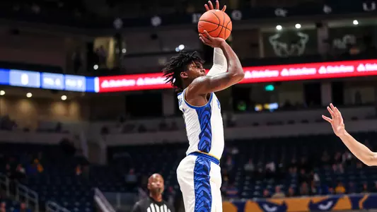 Gerald Drumgoole, Jr. shooting over a defender.