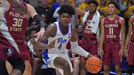 Gerald Drumgoole, Jr. dribbling past a defender against Florida State.