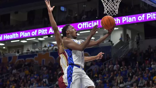 Xavier Johnson shooting a layup against Florida State.
